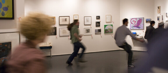 people running around a gallery
